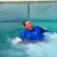 Mayor Matt White slid down one of the slides at the El Reno Municipal Swimming Pool, which reopened after a year's break due to the pandemic.