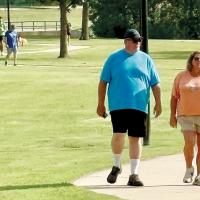 Guests of the ribbon-cutting walk and jog along the trail
