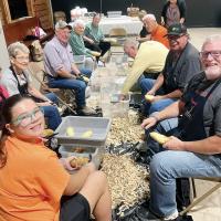 Members of Heaston Church peel potatoes in preparation for the Annual Heaston Chicken Dinner
