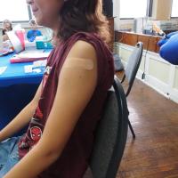 A nurse vaccinates a child at the Latino Community Development Agency in Oklahoma City