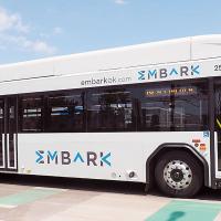 An Embark bus drives past the Downtown Transit Center