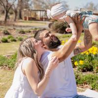 Jordan and Luis playing with their young daughter