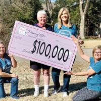 Kim Baker, Tammy McKee, Nancy Campbell and Anita Bishop show off the oversized check