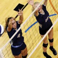 El Reno High School volleyball players Jennis Goucher (4) and Avery Peffer (19) watch the ball sail wide of their double block attempt during the recent El Reno Invitational. Both players had at least one kill in the win over Tuttle.