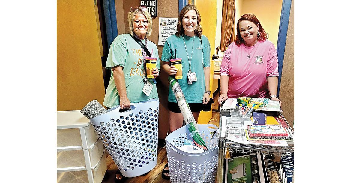 Trisha Murray (left) and Brooke Ferguson show off their new supplies with Amy Neathery (right)_slideshow