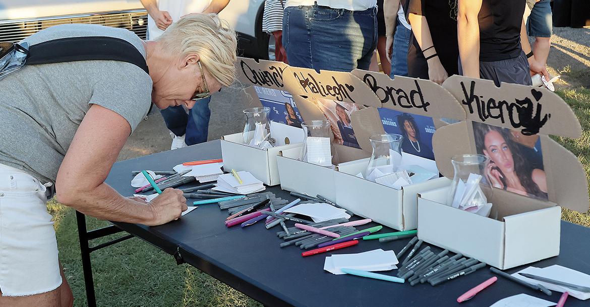Kandy Conner writes a note to each of the teens_slideshow
