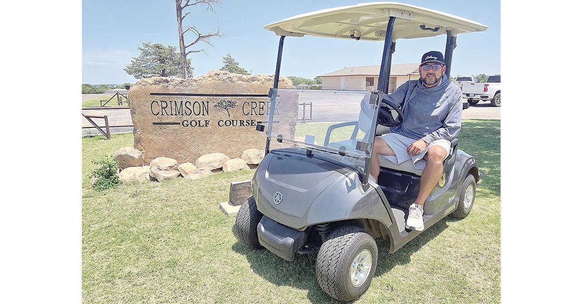 Kevin Armold shows off one of the 50 Yamaha gas golf carts_slideshow