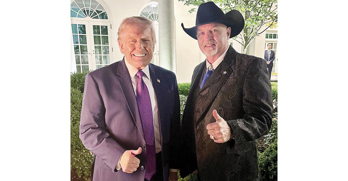 Donald Trump and Chris West pose for a photo in the Rose Garden_slideshow
