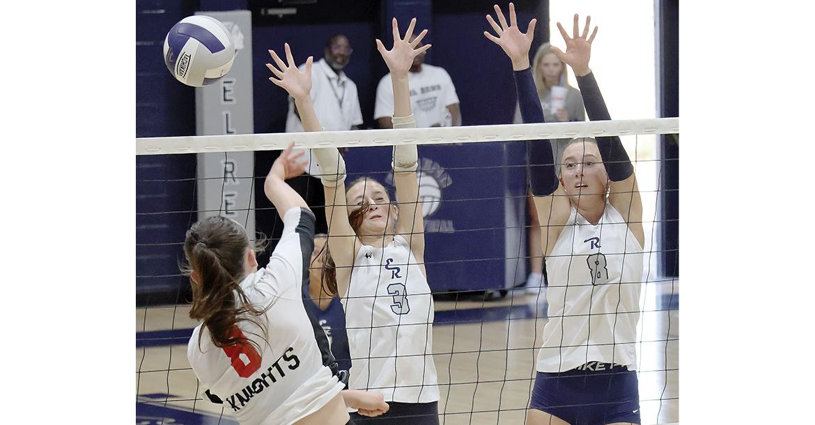 Jillian Reavis (3) and Brantlie Charmasson (8) attempt a double block_slideshow