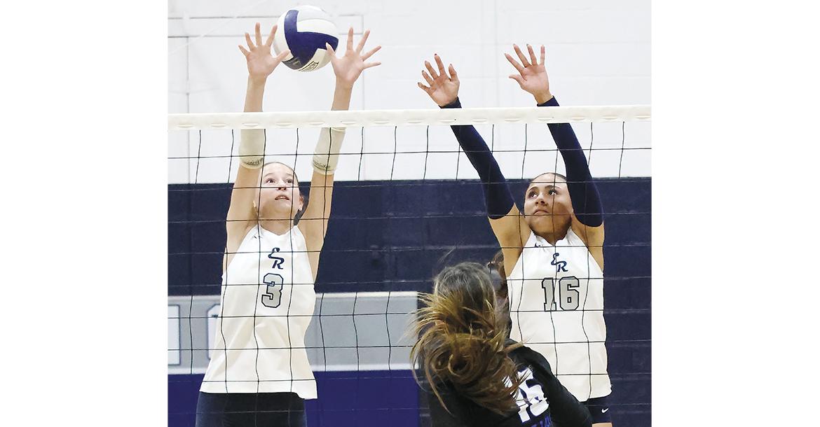 Jillian Reavis (3) and Mary Gonzalez (16) just miss a double block attempt_slideshow