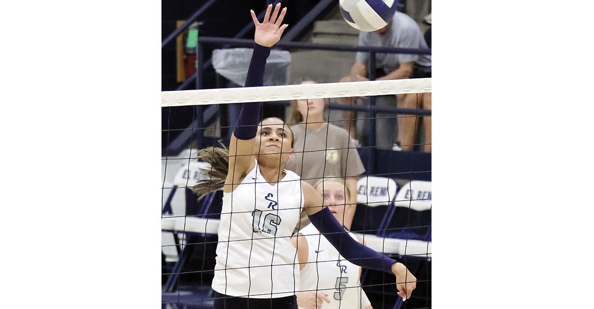 Mary Gonzalez hits a kill attempt over the net_slideshow