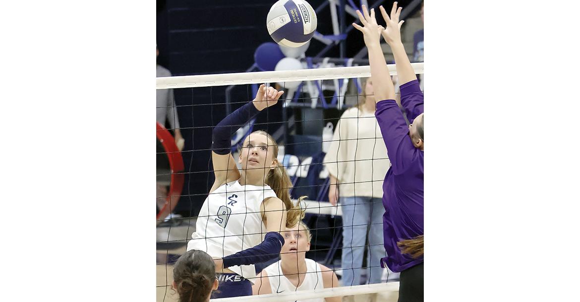 Quinn Charmasson tries to power a shot around a Bethany blocker_slideshow