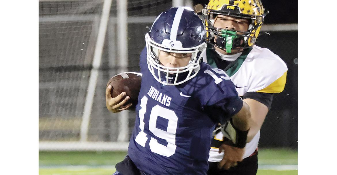 Isaac Salgado tries to pull his arm away from a tackle attempt_slideshow