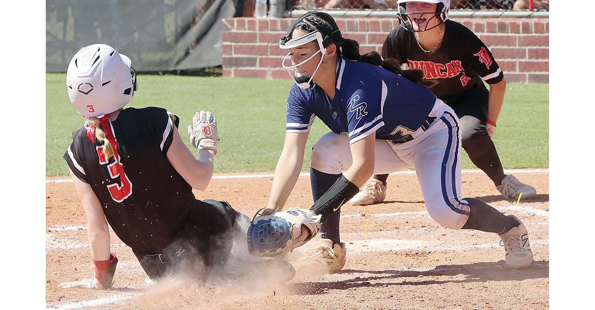 Zoey Pawnee tags out a Duncan base runner at the plate_slideshow