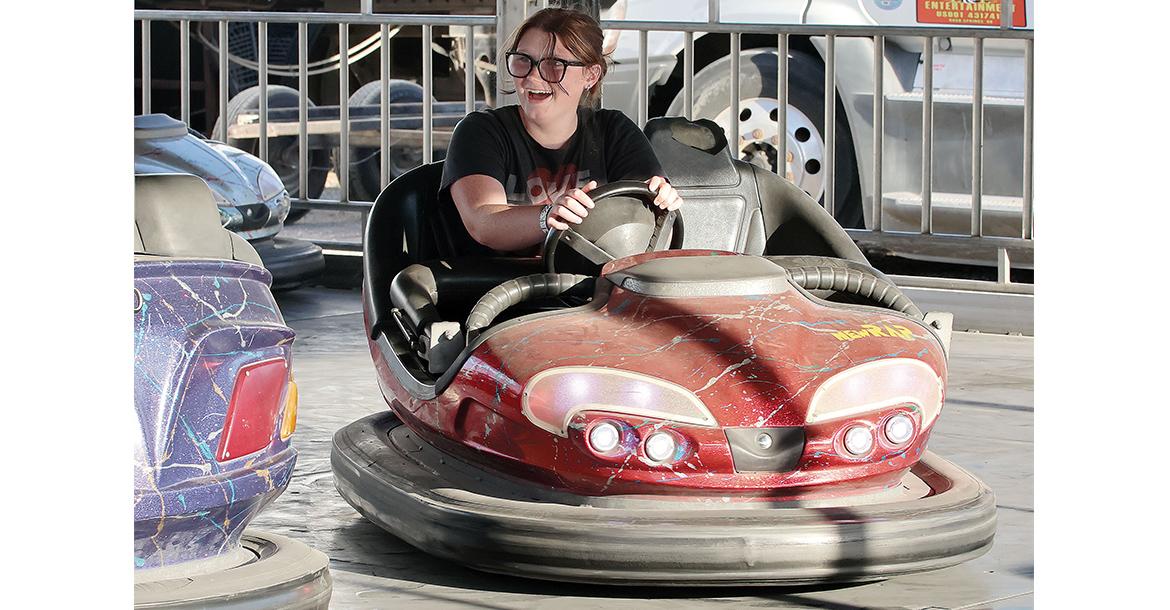 Gracey Buckner tries to crash into another bumper car_slideshow