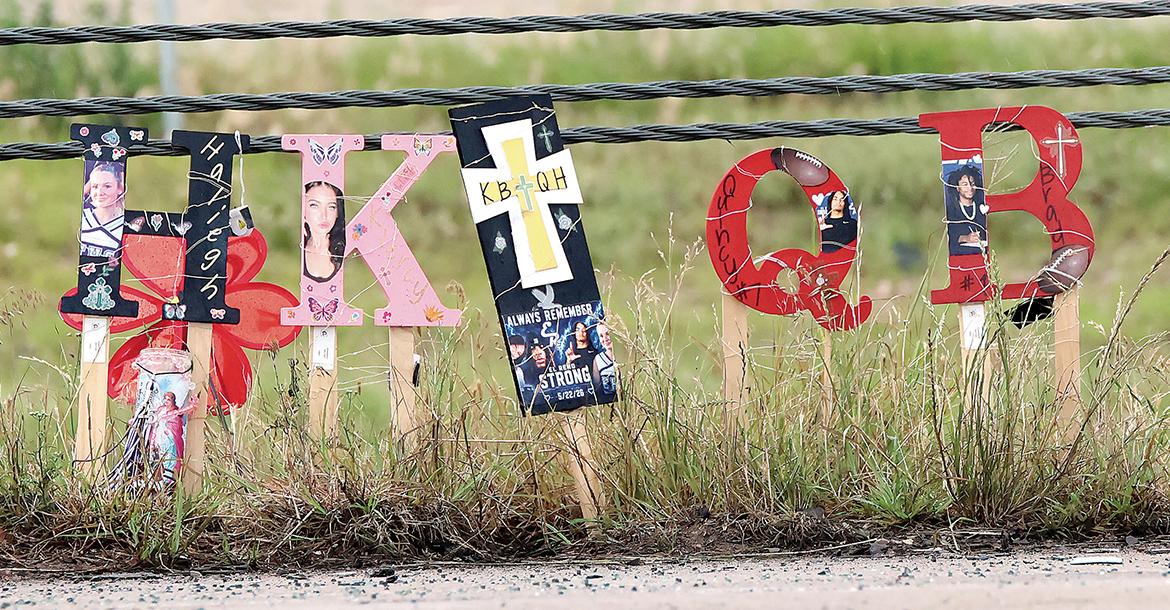 One of the roadside memorials for the four young adults killed in the May wreck_slideshow