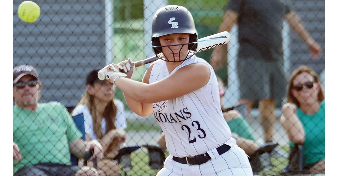 Lexi Porter watches a high pitch sail past the senior_slideshow