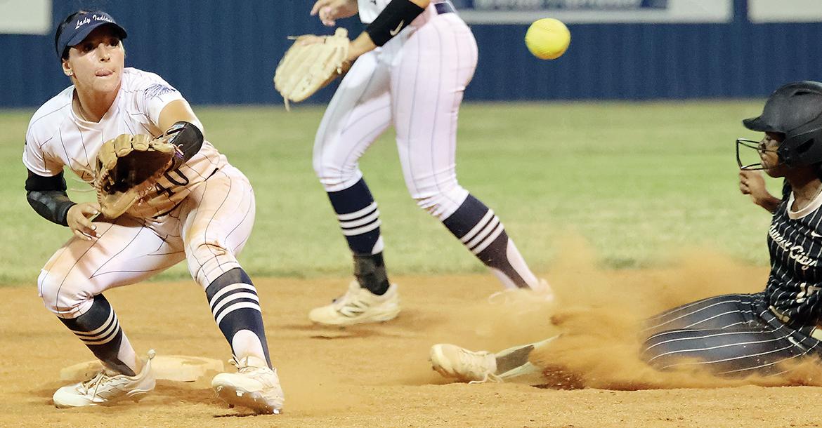 Maddie Fox reaches out to snag a pickoff throw_slideshow