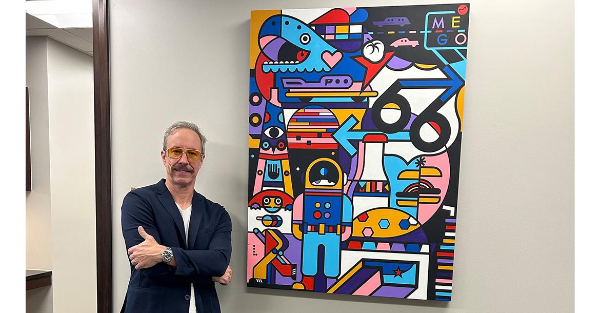 Matt Goad stands next to his Route 66 tribute work_slideshow