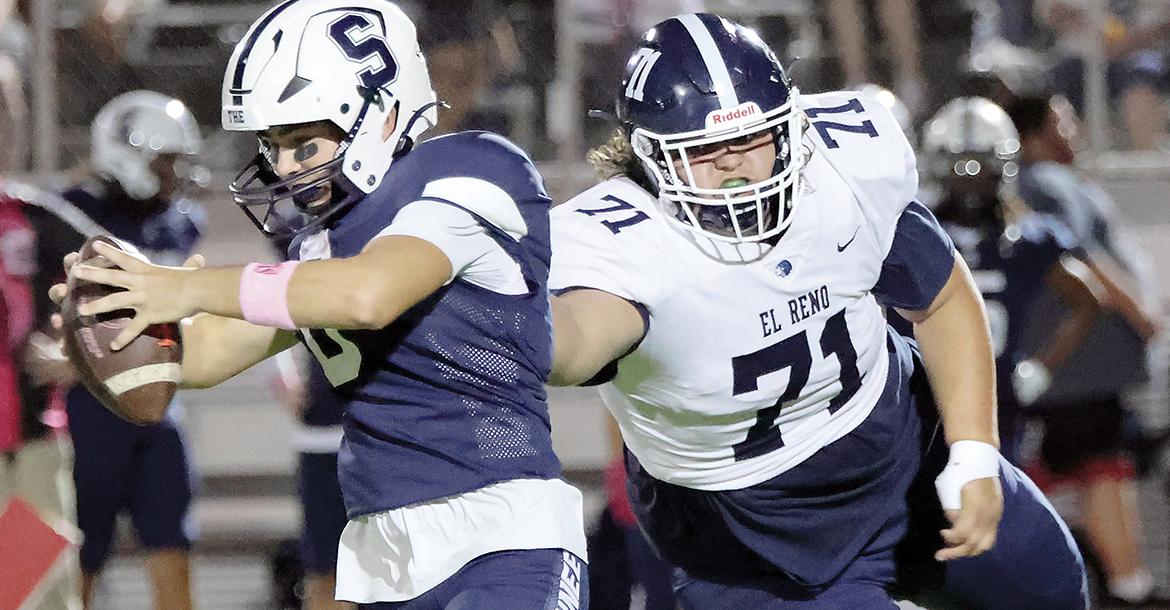 Nyke Hatton pulls down Shawnee quarterback Tal Leone_slideshow