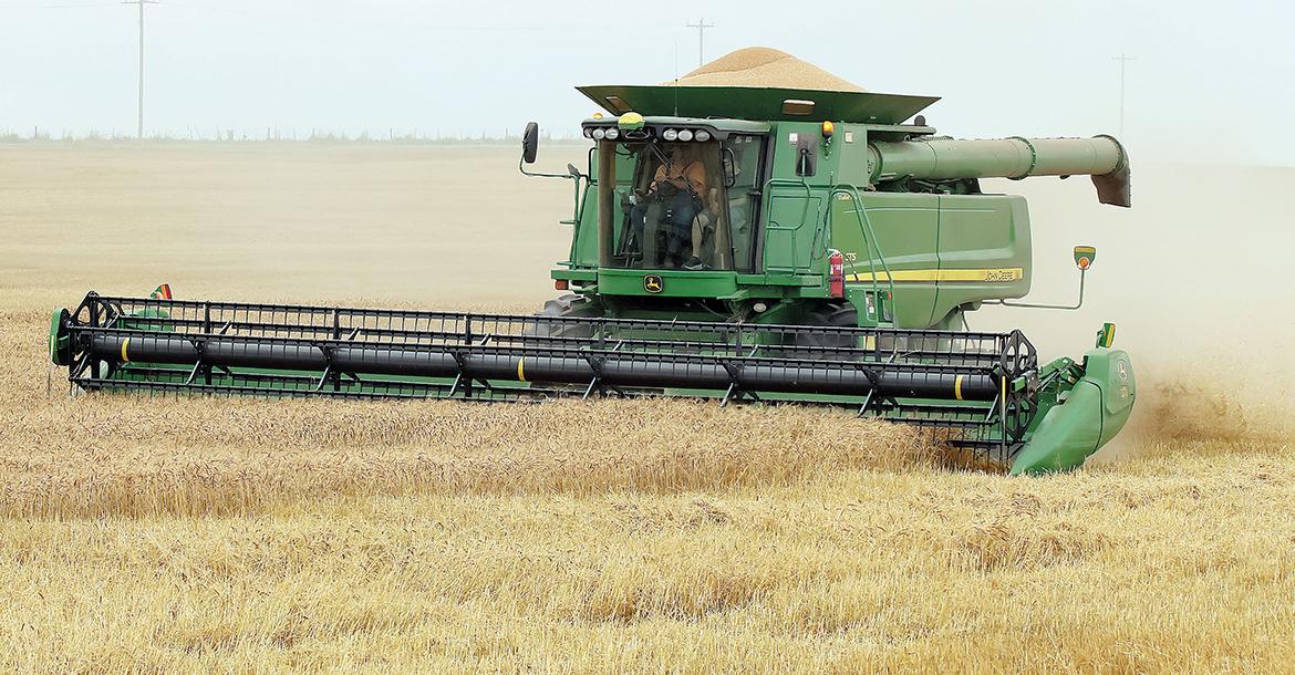 Nick Owen cuts wheat in one of his fields west of Calumet_slideshow