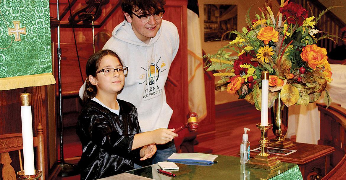 Emerson Brummett pounds the gavel as Rance Nitzel looks on_slideshow