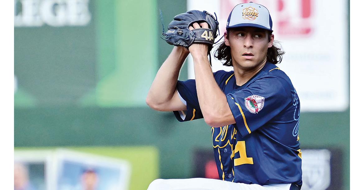 Rhett Kouba eyes the plate as he winds up for a pitch_slideshow