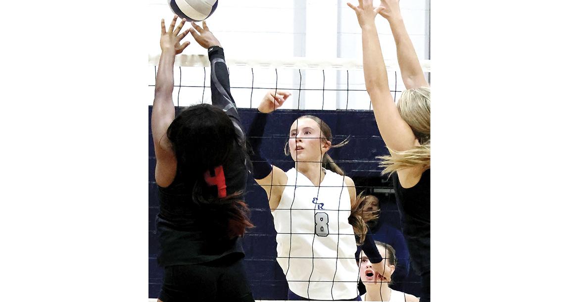 Brantlie Charmasson tips a shot over a solo block attempt_slideshow
