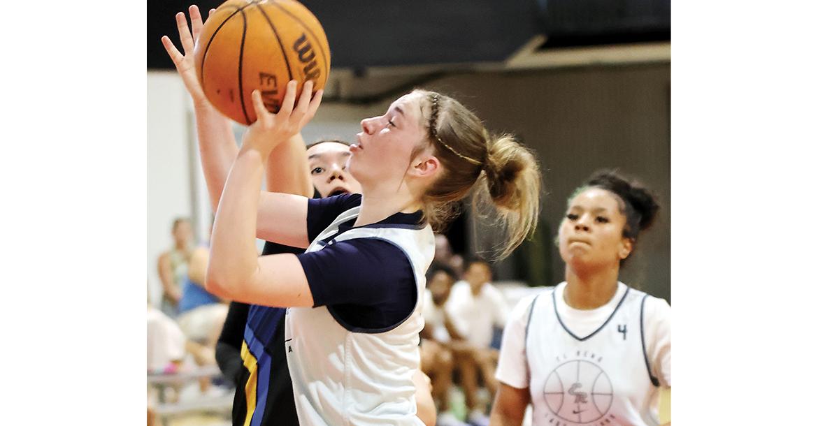 Halli Ferguson shoots a contested jumper in the paint_slideshow