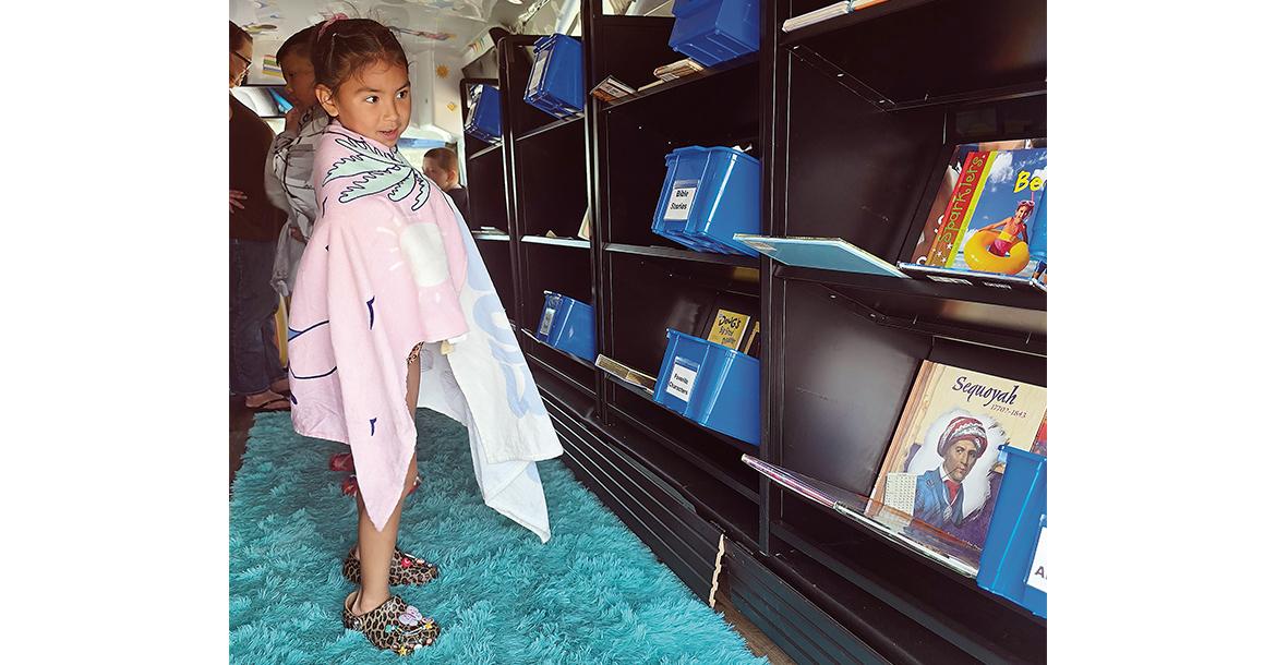 Mia Gilbert looks for a book_slideshow