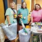 Trisha Murray (left) and Brooke Ferguson show off their new supplies with Amy Neathery (right)