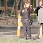 Kirk Dickerson (hat) listens to information being relayed while Capt. David Beaty takes a photo