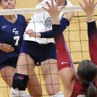 Brantlie Charmasson tries to hit through a block at the net by Tuttle