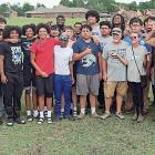 Connie Holt and husband, Bob Ballhorn (front row gray shirts) got help from the EHS football team
