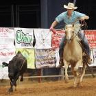 Kal LaFoe throws his rope over the head of a calf