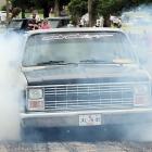 Kevin Watson (orange cap) watches this pickup churn out the smoke