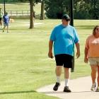 Guests of the ribbon-cutting walk and jog along the trail