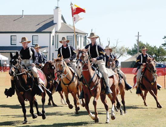 Members from the famed 11th Armored Cavalry Regiment ride in formation