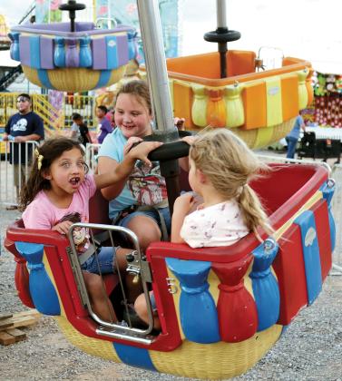 Local children react to one of the rides during the 2022 Canadian County Free Fair