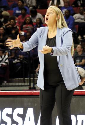 Jennifer Douglas shouts out instructions to her players in the 5A state championship game