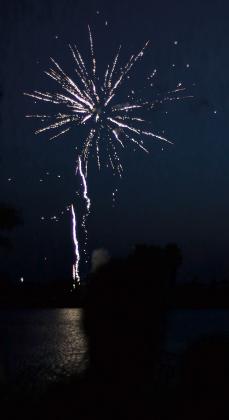 One of the opening bursts of the city's fireworks display at Lake El Reno.