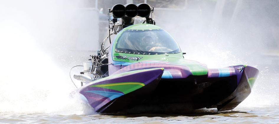 Jimmy Kemp drives out of a wall of water with his capsule boat