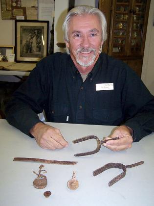 Art Peters shows some of the artifacts found in the Red Rock Canyon area