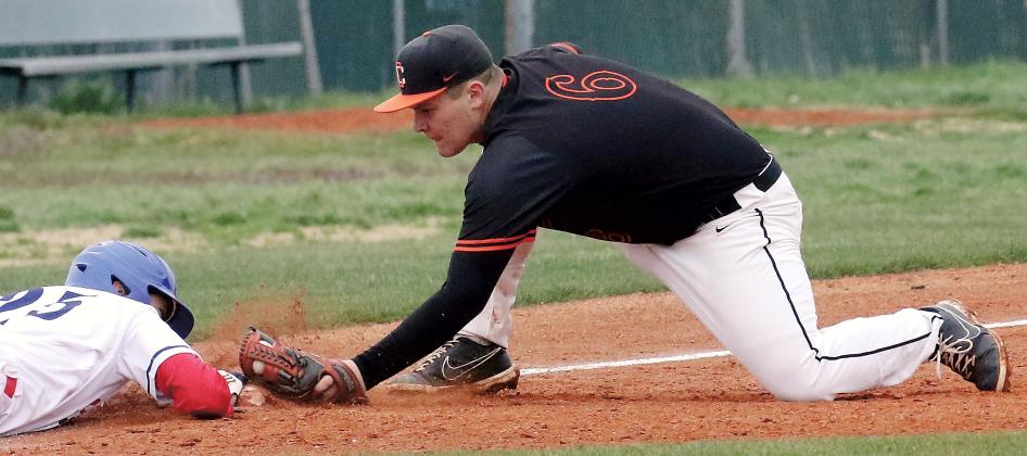 Carson Cooper reaches out to tag a Southwest Covenant School base runner