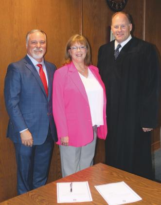 Paul Hesse, right, stands beside Tom Manske and Tracey Rider