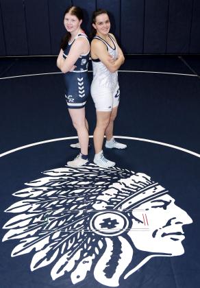 Hannah Koen (left) and Kaylee Davis are the first females in EHS history to qualify for the Oklahoma State High School Wrestling Championships