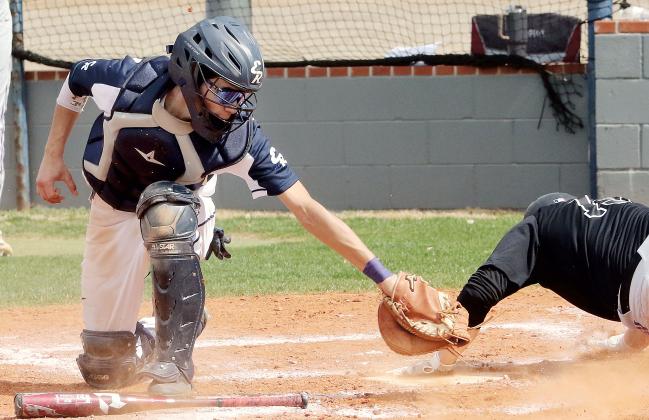 Austin Castanon just misses the elbow of a Chickasha base runner