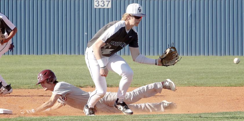 Gavin Tinsley steps in front of a Clinton base runner to snag a throw