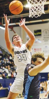 Kolton Hunt is fouled while shooting a layup