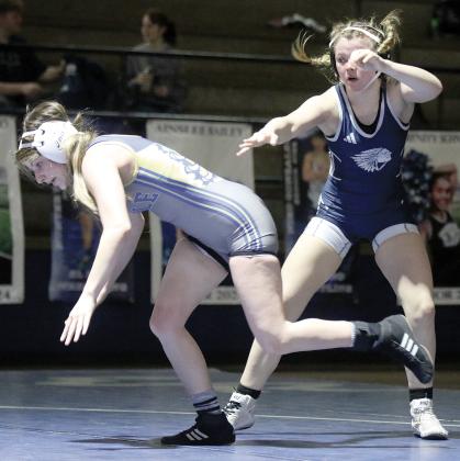 Brooklynn Huggins pushes off a Noble opponent to set up a takedown move
